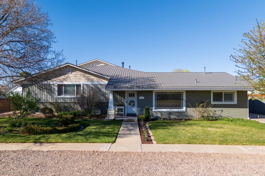 Experience the perfect blend of space, comfort, and versatility in this expansive 7,609 sq ft home situated on a generous .42-acre lot, featuring 7 bedrooms and 6 bathrooms. Designed for both everyday living and entertaining, the home offers a welcoming formal living room and a spacious office/library.

The kitchen is beautifully appointed with quartz and granite countertops, flowing seamlessly into the family room with surround sound for an enhanced entertainment experience. The primary suite is privately situated and features a cozy sitting area with a see-through fireplace, along with a luxury walk-in closet complete with its own washer and dryer.

Tile flooring throughout high-traffic areas adds durability and style, while an additional living space showcases custom built-in cabinetry for added function and charm. The home also includes a dedicated craft room and a convenient fruit storage room complete with shelving and a freezer--perfect for organization and food storage.

Step outside to a fully landscaped yard with mature trees, a garden area, cement basketball pad, playhouse, and chicken coop--offering both recreation and a touch of rural living. A Trex deck with custom steel railing extends off the primary suite, creating a peaceful retreat above while providing a covered patio below, ideal for gatherings.

A unique highlight is the 810 sq ft double garage conversion, now a fully equipped band studio with electricity and AC, offering endless possibilities for creative or functional use.

Originally renovated in 1997 with a thoughtfully designed addition completed in 2012, this home combines space, character, and flexibility in one exceptional property.