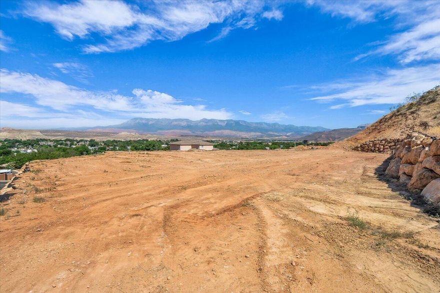 This 0.30-acre lot is part of four contiguous parcels, offering endless potential. It's the perfect place to build your dream home, surrounded by peaceful desert landscapes and breathtaking views. You also have the option to add an accessory dwelling unit (ADU) for additional living space or rental income. For builders and developers, these lots offer excellent investment potential and back up to an incredible ridgeline that enhances privacy and scenic value. With no HOA and the ability to bring your own builder, the possibilities are wide open. Located near Zion National Park, Sand Hollow, Warner Valley, sand dunes, and world-class outdoor recreation, this is a rare opportunity to create something truly special. Buyer/buyer agent is responsible for verifying all information.