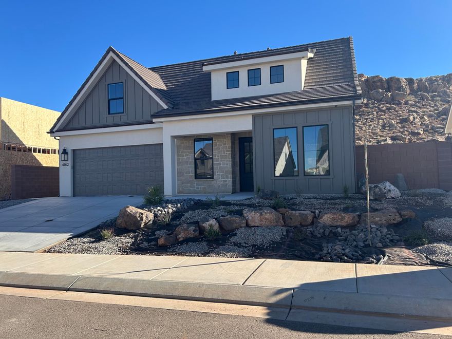 This custom-built, craftsman-style home offers uninterrupted natural views from expansive windows and a private backyard retreat! Step inside to 9' ceilings, a formal dining room, and a versatile flex space. The heart of the home is a stunning open living and kitchen area, designed to impress with two-tone custom cabinetry, premium quartz countertops, rich hardwood flooring, and elevated millwork throughout—an exceptional setting for both everyday living and elegant entertaining. The main-level primary suite is a true sanctuary, complete with its own private laundry closet with washer and dryer included. Upstairs, three spacious bedrooms each with walk-in closets are complemented by a generous family room, a full laundry room, expansive storage and stunning mountain views... The insulated garage offers sidelights, exterior access, and the  energy-efficient features include zoned HVAC and added insulation between floors for year-round comfort. CAT5 ethernet and coax pre-wiring, plus extra sound insulation in the primary bedroom. Gas/electric hookups for both the kitchen and laundry, and even soffit outlets for outside holiday lights. 

This home is filled with thoughtful upgrades from a builder known for meticulous craftsmanshipevery detail sets it apart. Schedule a showing today to experience its quality firsthand.

Bonus: Preferred lender rate buy down may be available! Multiple programs could work for youask us for details.