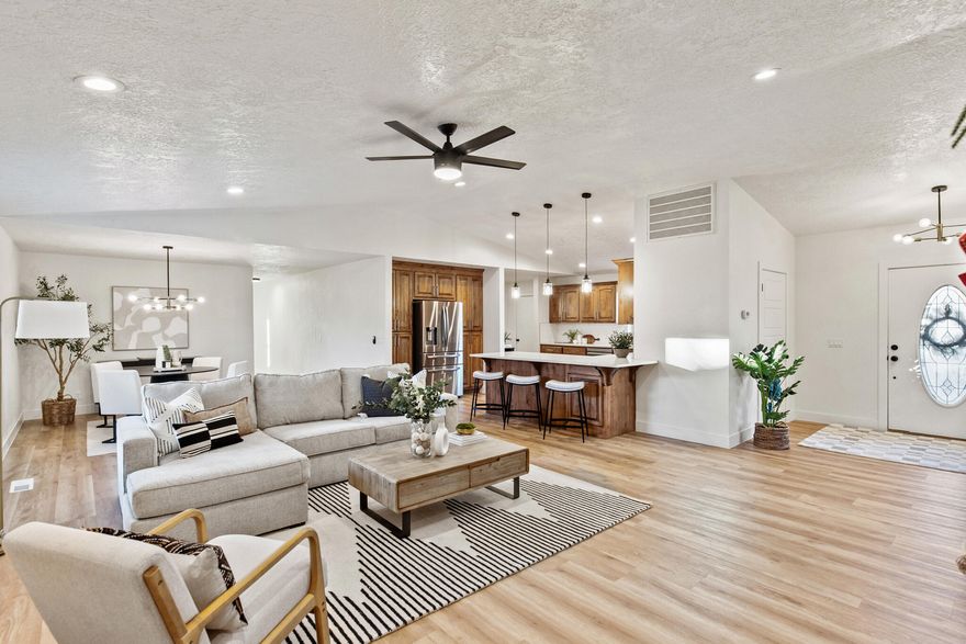 Fully remodeled + multi-generational living in Bloomington! This home sits on a 1/3-acre lot just steps from the Bloomington Golf Course with NO HOA and minutes from the Country Club. Highlights: 5 bedrooms + 3.5 baths AND an attached casita with full kitchen, private laundry & bathroom — perfect for multi-gen living, guests, or rental income. Brand-new kitchen with quartz counters & new appliances. Spa-like primary suite. Custom fireplace with timber accent. RV parking, 2-car garage & oversized driveways. Completely updated with high-end finishes throughout — truly turn-key in one of St. George's most established golf communities. Homes like this rarely come available. Call agent to schedule a private showing!