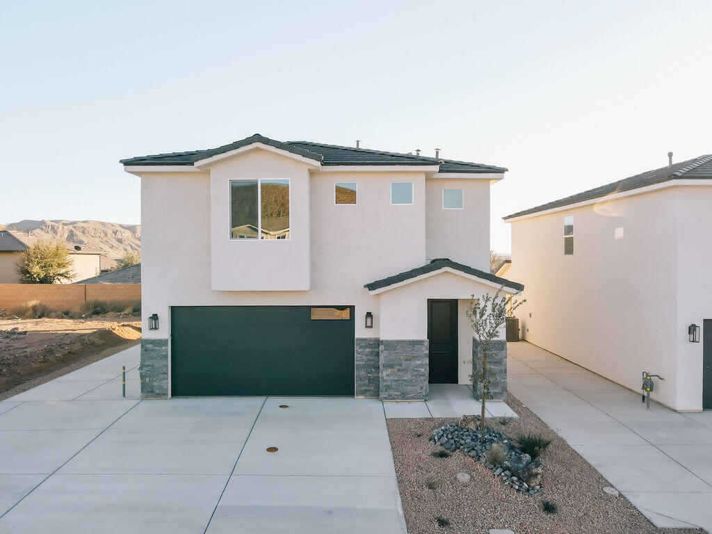 Discover the perfect blend of comfort and adventure in this gorgeous 4-bedroom, 2.5-bathroom home in the desirable Hurricane Hollow subdivision! Spanning 2,263 sq. ft., this thoughtfully designed home features modern touches like granite countertops and durable LVP flooring throughout. The fully landscaped yard and convenient RV parking offer both curb appeal and functionality. Located just minutes from top-rated schools and endless outdoor recreation—including hiking trails, ATV riding, and picturesque lakes—this home is a gateway to Southern Utah's natural beauty. Experience the lifestyle you've been dreaming of in Hurricane Hollow!