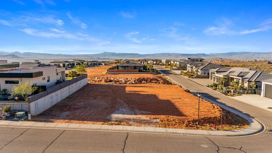 Discover the perfect canvas for your dream home in the prestigious, gated community of Westgate Hills. This rare 0.38-acre pad-ready lot offers a seamless start to building, saving you time and expense while allowing you to focus on designing the home you've always envisioned. Nestled in the highly sought-after Green Springs area, this property captures truly breathtaking mountain views and stunning desert landscapes that define Southern Utah living at its finest. 

Westgate Hills is known for its upscale homes, quiet surroundings, and secure gated access, offering both exclusivity and peace of mind. Whether you're looking to build a full-time residence or a second home retreat, this lot provides the perfect blend of tranquility and convenience.

Located just minutes from some of the area's best amenities, you'll have easy access to premier golf courses, scenic hiking and biking trails, and a variety of dining and retail options. Enjoy the balance of a serene neighborhood setting while still being close to everything you need.

Opportunities like this are becoming increasingly rare--especially pad-ready lots in such a desirable location. Don't miss your chance to secure one of the last remaining homesites in Westgate Hills and bring your vision to life in one of the most beautiful and established communities in the Green Springs area.