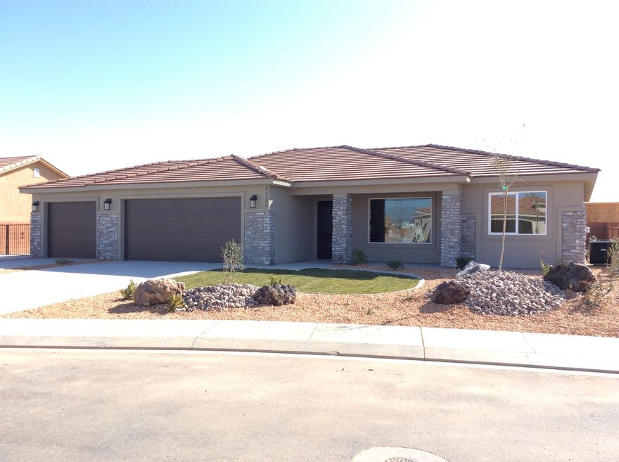 Construction is underway with Gemstone Custom Homes! Some photos are from previously built homes of the same floor plan. Estimated completion in early 2026. This one is truly one-of-a-kind as you'll have a three-car garage PLUS a 21' wide, gated RV pad with full hookups on the garage side of the house! Drought resistant landscaping in both front and back with an automatic drip system, artificial turf and decorative rocks. Flooring in the main areas and bathrooms is durable wood-grain tile, classic-style hardwood cabinets with soft-close hinges and under cabinet lighting, 3 cm thick quartz countertops, walk-in tile shower is separate from the tub in the master bathroom, high quality Moen plumbing fixtures, GE appliances, covered patio in the back, fully finished and painted garage.