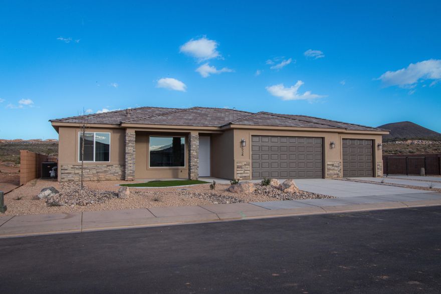 Gemstone Custom Homes has a special one here for someone with takes their hobbies seriously. With a three-car garage PLUS a 21' wide, gated RV pad with full hookups, and plenty of room for a future shed.  Drought resistant landscaping in both front and back with an automatic drip system, artificial turf and decorative rocks. Flooring in the main areas and bathrooms is durable wood-grain tile, classic-style hardwood cabinets with soft-close hinges and under cabinet lighting, 3 cm thick quartz countertops, walk-in tile shower is separate from the tub in the master bathroom, high quality Moen plumbing fixtures, GE appliances, covered patio in the back for afternoon shade, fully finished and painted garage and no HOA!