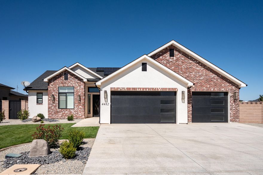 Welcome to this immaculate turn-key home packed with high-end extras and custom features throughout! Perfectly designed for comfort, function, and style, this 4-bedroom, 2.5-bath home offers an open-concept layout ideal for entertaining and everyday living.  Interior Features:  Spacious open floor plan with plenty of natural light; Custom window coverings; Remote controlled blinds; Beautiful custom-built china hutch in the dining area; Water softener system; Solar panels with battery backup; Move-in ready condition with modern finishes throughout. Exterior & Garage:  Fully landscaped front and back yards with custom curbing; Decorative finish on the block wall fence for added appeal; Covered back patio perfect for relaxing or entertaining; Oversized 3-car garage with built-in custom storage cabinets; Large 12' x 25' shed with a finished interior  ideal for a workshop, gym, or extra storage.  This home checks all the boxes  upgraded, efficient, and meticulously maintained.