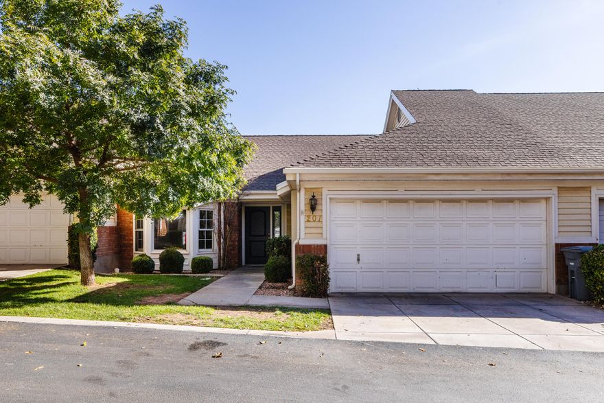 Beautifully maintained 2-bedroom, 2-bath townhome with new carpet, fresh paint, and in excellent condition throughout. The kitchen features granite countertops and upgraded stainless appliances. Enjoy a large great room, dedicated laundry with washer and dryer included, and generous storage—including an oversized 2-car garage with attic space and a water softener. The private backyard with a covered patio offers a peaceful outdoor retreat. Located on tree-lined streets near guest parking and the community pool, this home is truly move-in ready and a great value in Red Canyon Townhomes.