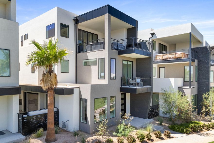 This Luxury vacation home, approved for short term rentals in the vibrant Desert Color community comes fully furnished and turn key ready - from the bedding to the dishes, everything is included. Whether you're seeking a personal sanctuary or a high-performing investment, this property has everything! Just steps away from the lagoon, start your day with pickleball, enjoy an afternoon at the beach, and wrap up your evening with popsicles and board games on your private deck. The home features 5 bedrooms, 3 of them include their own en-suite, with a total of 4.5 bathrooms. The open-concept main floor boasts a bright, airy kitchen and great room, with a 12 foot-wide multi-slide door leading to your outdoor living and hot tub area.