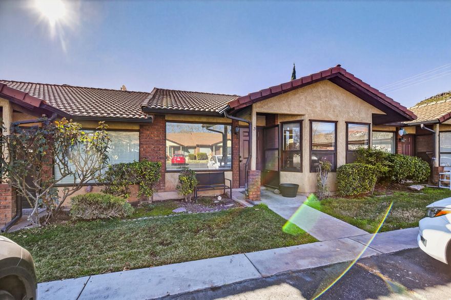 This 2-bedroom, 2-bath home is ideal for a first time buyer, retirement home, or second home getaway. Also, long-term rentable! Featuring brand new tile flooring in the primary bathroom and easy to maintain flooring throughout the main living areas. The spacious primary suite features a large walk-in closet and private access to a fully enclosed back patio. A walk-in laundry room with additional storage sits alongside the second bedroom and full guest bath. The home includes one covered parking space, an additional spot directly in front, and ample guest parking throughout. Buyer to Verify all info.