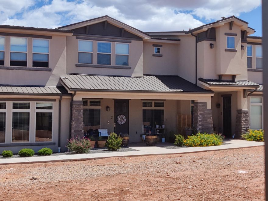This is the best-priced townhome in Sage Villas -- and it delivers. Surrounded by the beautiful scenic red mountains and desert landscape views. Three bedrooms, two and a half baths, 1,767 square feet with a large loft that flexes to whatever you want; Office, bonus room, extra storage. The epoxy garage floor, covered front patio, and quality finishes throughout give it a polished feel without the inflated price tag and low HOAs. Ivins is one of the most in-demand areas in Washington County, and at this number, this one won't sit long.