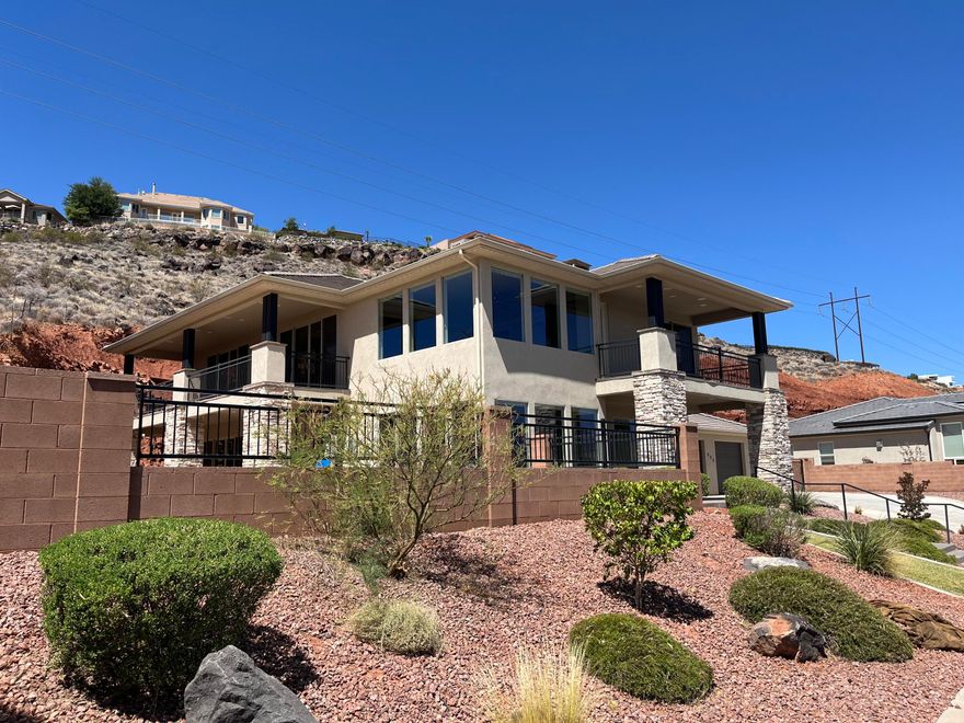 What a fabulous home, centrally located with terrific mountain and city views in a culdesac! Heated pool w/spa on over an acre. $18,000 surround system, New HVAC motor and water heater. Hidden safe room. Fully upgraded and custom built with 5 car garage, including climate controlled workshop. RV parking too. Must See!