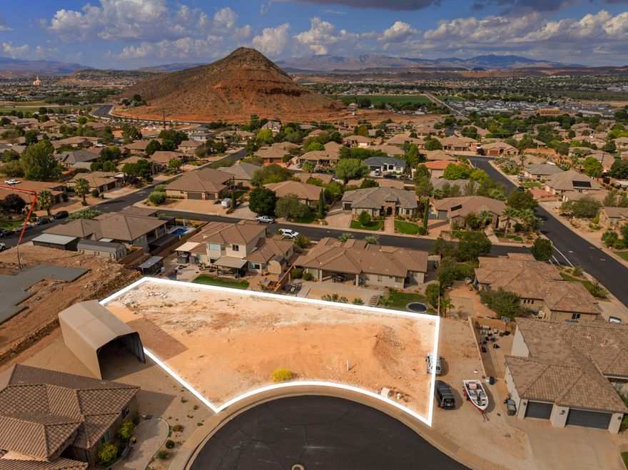 Build your dream home at the top of a quiet cul-de-sac with sweeping red rock and mountain views! This rare walk-out basement lot sits in one of Washington's most desirable established neighborhoods—close to everything, yet tucked away for peace and privacy. The unique shape of the lot offers creative flexibility for your custom design, with space for RV parking, a pool, or expanded garage. Perfect for a walk-out basement, this homesite takes full advantage of the natural slope and stunning backdrop of Pine Valley Mountain and the Red Cliffs. Come see why the Washington Bench is one of Southern Utah's hidden gems—quiet streets, beautiful homes, and breathtaking views in every direction.