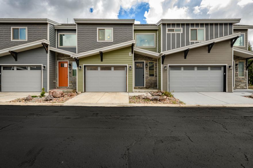 Brian Head Townhome with the Ski Lifts Basically Across the Street  |  Forget long parking lot walks and hauling ski gear halfway across town. The Navajo chair lifts are right across the street from this three-story Brian Head townhome, which makes first chair a whole lot more realistic. Inside, the main living space is built for post-mountain recovery: open layout, cozy gas fireplace, and enough room for everyone to pile in, warm up, eat, and tell exaggerated stories about the run they definitely almost landed cleanly. The kitchen keeps things modern with stainless appliances, sleek finishes, and enough room to cook for a crowd. Downstairs, the bunk room is ready for the fun group, featuring two triple bunks, an electric fireplace, and its own bathroom. Translation: kids will love it, and adults might try to claim it first. Updated finishes throughout keep the home feeling fresh and comfortable without trying too hard to be fancy. When ski season winds down, you're still close to Cedar Breaks, Giant Steps, Bristlecone Pond, hiking, fishing, mountain biking, Bryce Canyon, and Zion. A mountain getaway that's actually set up to be used, not just admired from a brochure.