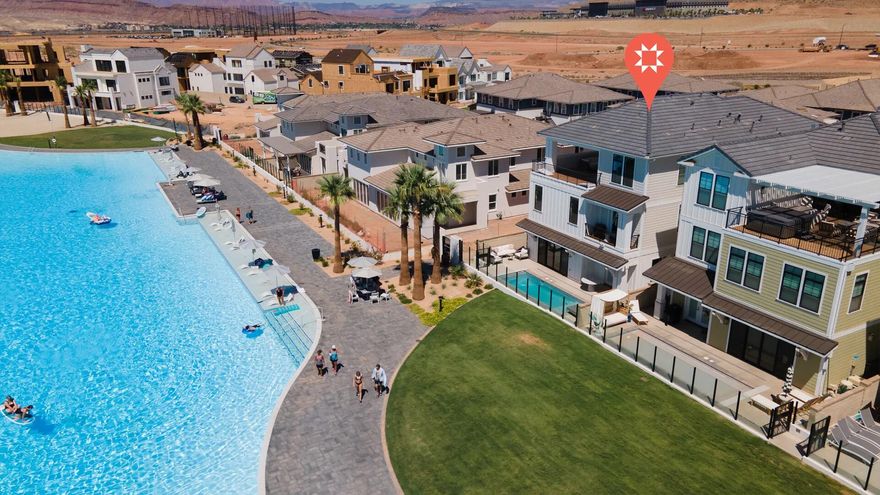 Co-Ownernship Vacation Home. Sold in 1/8th Ownership. This incredible Ember Vacation Home sits directly on the Lagoon at Desert Color. This Newport Beach style boardwalk home that sleeps 30 can fit the whole team or can be offered as a nightly rental. HOA includes: Lagoon access, clubhouse pool, sundeck, and pickleball. Enjoy swimming, kayaking, and paddelboarding at the bluest lagoon in St. George. Square footage figures are provided as a courtesy estimate only and were obtained from Builder. Buyer is advised to obtain an independent measurement.