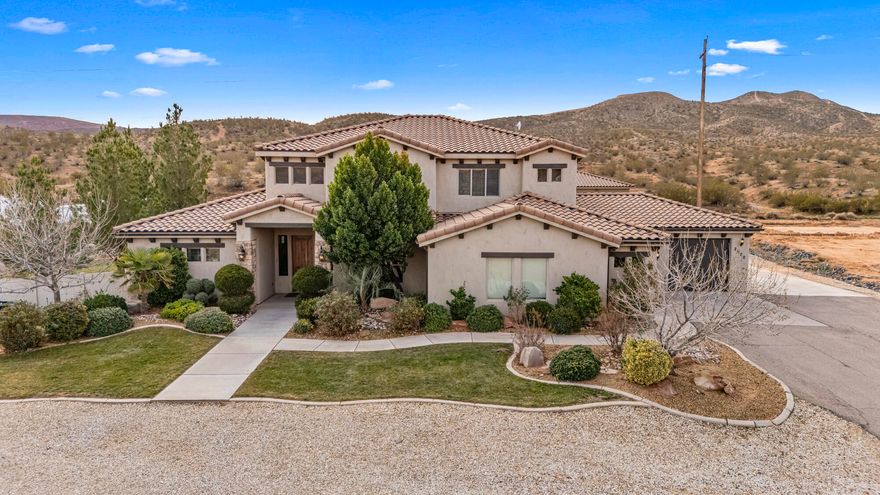 Set on 1.81 acres backing to BLM land, this private country-ranch property delivers exceptional land, PRIVACY, and parking, with NO CC&R's or HOA fees. The home is set well off the road and offers EXTENSIVE ON-SITE PARKING and garage capacity, including a 3-car attached garage, a separate RV garage with room for four vehicles, and an RV PAD with full hook-ups. A 2-bedroom CASITA/ADU on a separate power meter adds valuable flexibility.
The backyard features a POOL, hot tub, OUTDOOR KITCHEN, and lit SPORTS COURT, surrounded by ANIMAL-FRIENDLY acreage. Inside, the main level includes a large primary bedroom and separate office with ensuite bath. Upstairs offers TWO Jack-and-Jill bedroom sets, a living area, and a bonus room.
A rare opportunity with acreage, privacy, parking, and an ADU. A rare opportunity for acreage, privacy, parking, and a separate ADU.