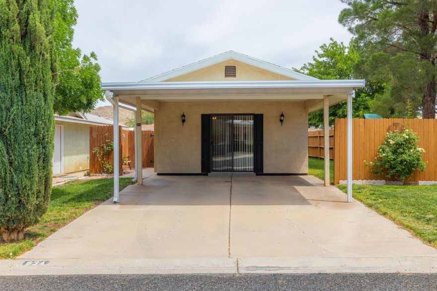 Well-maintained 2 bed, 1 bath stick-built home with a private, fully fenced, low-maintenance backyard. Bright open floor plan filled with natural light. Conveniently located near two reservoirs, shopping, and hospitals, and just minutes from Zion National Park. Located next to a park featuring large mature trees and a play structure. New water heater recently installed. Community clubhouse offers indoor and outdoor pools, exercise room, and clubhouse amenities.