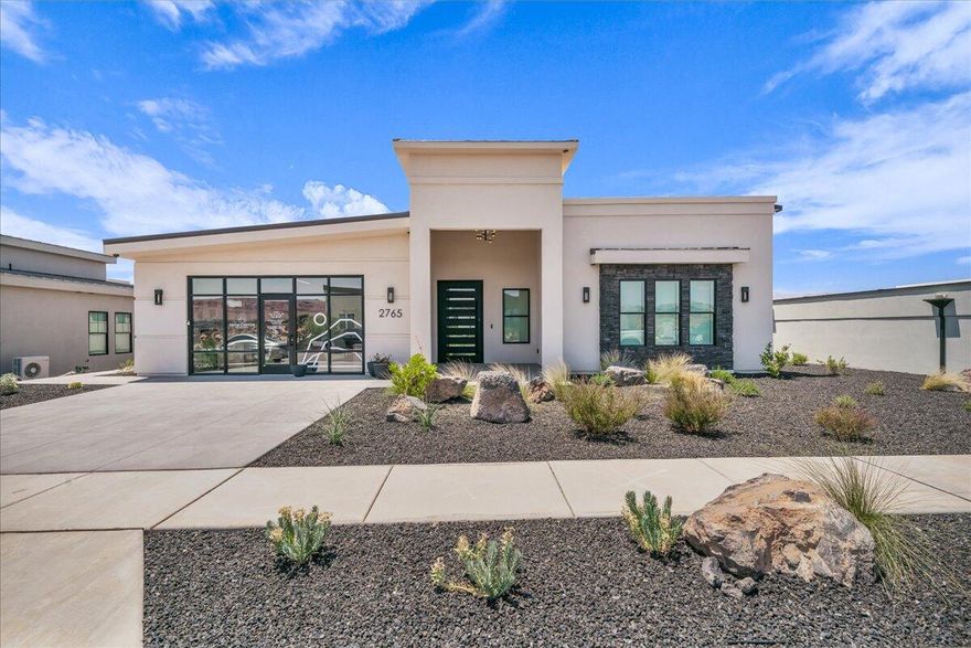 Discover Southern Utah's newest 55+ community, where retirement living is reimagined. Set on 25 acres of stunning desert landscape with 300 days of sunshine, Snow Canyon offers incredible views, endless outdoor recreation, and close proximity to state and national parks. Unique to this community are just 44 privately owned homes with a variety of floor plans and lot sizes. Lot 23 features the Iron Mountain plan, a thoughtfully designed home with 2 bedrooms, 2.5 bathrooms, a flex room, and a two-car garage. Enjoy sleek modern exteriors, smart home technology, custom interiors, and a beautifully finished kitchen with premium tile and cabinetry. Community amenities include an 18-hole championship putting course, saltwater pool and Jacuzzi, pickleball and bocce courts, multiple dining venues, an art gallery with rotating exhibits, a salon and spa, golf simulator, housekeeping, food delivery, and robust lifestyle programming. Optional monthly memberships offer expanded access and full accessibility features.
