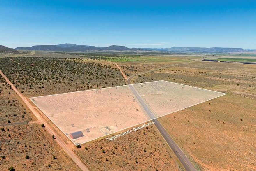 20 Acres for sale in Enterprise/Newcastle Utah. Only 12 minutes away from Newcastle Reservoir. Beautiful Mountain / Valley Views right at the foot of the mountains. See the stars at night. Build a home, cabin or bring your RV's, Camper's, Trailer's for a family retreat property. Parcel split by county road but can be subdivided into 2 separate parcels if interested. Each parcel is roughly 10 acres. Both sides are fully fenced. East parcel has goat and sheep fencing and 3 pastures. Close to the city of Enterprise for conveniences such as grocery, gas, hardware, medical, dental, restaurants. Enterprise Reservoir is nearby also. Plenty of trails for hiking and offroading with ATV's and UTV's. 25x40 barn can be purchased separately and has a 10' roll up door, man door, two windows and concrete footers. Barn will be removed upon closing.