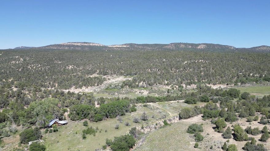 ''Beautiful Ranch Property'' between Mt Carmel Junction and the East Entrance of Zion National Park. Situated in the heart of some of the most magnificent scenery. This Lovely ''Old Ranch'' offers endless possibilities. It is comprised of 4 connecting parcels. Includes 50.6 shares of water which irrigates 12.656 acres. Property is in ''Green Belt''. Includes a 25 AUM permit. Access is approx 5 miles off Hwy 9 on a well maintained County Road. Property within a 1-2 hour drive to Bryce Canyon, the North Rim of the Grand Canyon and Lake Powell.