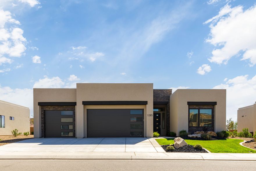 Located in a quiet neighborhood within The Ledges, this well maintained 4-bedroom, 3-bath home was built in 2023 and still feels like new!  With two ''En Suites'' the layout is open and bright with big windows that show off mountain and valley views. Whether you're enjoying your morning coffee or entertaining guests, this home offers a front-row seat to Southern Utah's most iconic scenery. With Snow Canyon State Park & The Ledges Golf course right next door there are endless outdoor opportunities awaiting. The private and fully fenced backyard showcases uninterrupted desert vistas views and covered patio. The low HOA includes all landscaping & pruning.