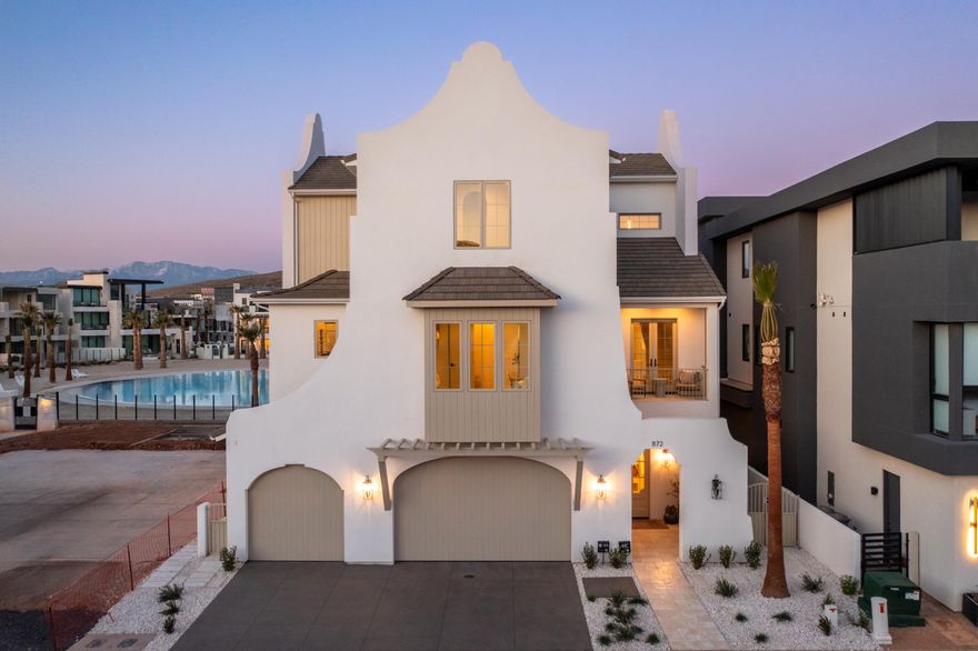 Welcome to your dream oasis in Desert Color, Utah! This exquisite seven-bedroom, 10 bath home embraces the coastal elegance of Rosemary Beach style. Boasting nearly 6,000 sq ft of luxurious living space, every detail exudes sophistication. High-end tile, lighting, and finishes create a seamless blend of comfort and style. Experience the pinnacle of beachside living in the heart of the picturesque Desert Color community.