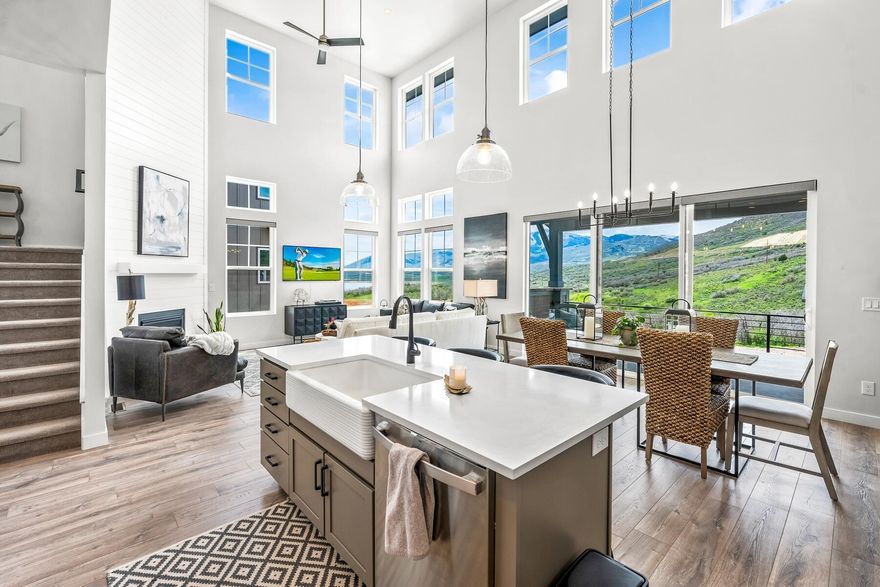 Fully furnished and available for a 6-12 month lease.  Ideally located on the outskirts of Park City, this immaculate Hideout townhome offers all the appeal of Park City living, without the hustle and bustle of living in the ever-popular resort town. Upon entering the striking property, guests will be greeted with awe-inspiring views of both Deer Valley Resort and Jordanelle Reservoir, both just minutes away. Meticulously cared for and designed, this mountain modern residence is offered move-in ready and fully furnished. At nearly 2,300 square feet, the unit boasts three bedrooms, three baths and a 2-car garage designed to house all of your outdoor adventure gear. The spacious living area features massive windows highlighting the stunning scenery at every angle. With a gas fireplace as the focal point of the expansive space, guests are certain to want to stay and curl up on the sumptuous sofa after a long day in the outdoor oasis residents get to call home. The fully equipped kitchen conveniently opens to the dining and living room areas, with table seating for six and additional seating at the spacious island. The attached oversized balcony beckons the outdoors in and offers an additional space to relax and take in the landscape.  The primary bedroom is a relaxing retreat with plush, cozy bedding, flat screen television and spacious spa like en-suite bathroom complete with separate vanities, soaking tub and walk-in shower. Two additional generous bedrooms and a single bathroom round out the lovely upper floor.  Mere minutes from the Jordanelle Reservoir, this unit affords residents the opportunity to have water sports, swimming and boating at their fingertips, while world class skiing at both Deer Valley and Park City Mountain Resort is just an additional 10 minutes away. Year-round adventure and relaxation await in this remarkable unit.