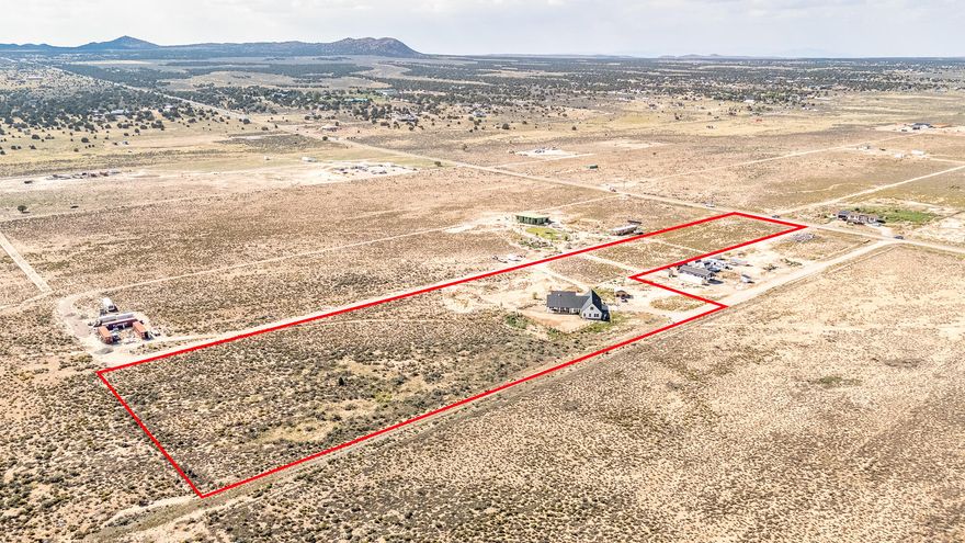 Situated on over 8 acres of land, this 3,200-square-foot modern home features four bedrooms and 3.5 bathrooms. The tall, bright entryway opens into a spacious area that could serve as a grand entrance, family room, or office. The open kitchen and living floorplan include a fireplace, two doors leading to the back patio, and space for a dining table. Behind the kitchen, you'll find a large laundry room, which connects to the master walk-in closet and bathroom. Two additional rooms share a half bathroom and a second full bathroom. Upstairs, there are two flexible spaces that can be used as bedrooms, a play area, storage, or a den, along with another full bathroom. The basement, measuring 28 x 12 feet, serves as a cold storage area. Although the home is plumbed for radiant heat on the main floor and driveway, a boiler has not yet been installed.
Enjoy the outdoors on your covered porch and patio, with the expansive 8.06-acre property providing ample space for relaxation and activities. This home is also equipped with a state-of-the-art security system featuring audio and cameras with speakers on the front porch, patio, and in the great room.Home is on a community well, water, maintenance and power bill for the well is split 3 ways at the end of the year with the other users. Usually around $300 total for all 3 people. Property allows another dwelling