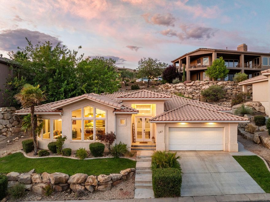 Yes, that's a real sunrise you could enjoy daily from this 4-bed, 2-bath home. Many have asked about the HOA so here is the scoop: $210 per month includes WATER UTILITIES it is effectively $150 per month to cover the Full Yard Maintenance, indoor/outdoor pools, hot tub, fitness center, and Clubhouse. Additionally it is just a short walking distance to the Southgate Golf Course  Perched above on a quiet street, it offers stunning views of the red rocks and Pine Valley Mountain. This home includes existing furniture and features a custom, open floor plan with a newly replaced HVAC, updated fixtures, and stainless steel appliances.