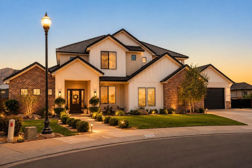 Tucked away at the end of a quiet cul-de-sac in highly sought-after Little Valley, this exceptional custom-built estate offers the perfect blend of luxury design, functionality, and resort-style living -- including the rare opportunity for qualified veterans to take advantage of an assumable VA loan (3.25%). Built in 2021 and thoughtfully designed for both entertaining and everyday living, this stunning 5-bedroom, 4-bathroom home spans approximately 3,500 square feet and sits on a beautifully landscaped 0.37-acre lot complete with a saltwater pool, hot tub, expansive patio spaces, and incredible garage/RV capabilities rarely found in Southern Utah.
From the moment you enter, you're welcomed by soaring ceilings, dramatic floor-to-ceiling windows, abundant natural light, and a striking stone fireplace anchoring the spacious great room. The open-concept design flows seamlessly into the gourmet kitchen featuring high-end finishes, oversized island seating, custom cabinetry, and an impressive butler's pantry offering exceptional storage and prep space.

The thoughtfully designed floor plan includes multiple living and entertaining spaces, including an upstairs bonus/family room along with two upstairs bedrooms -- one featuring a private ensuite bath and walk-in shower -- creating the perfect setup for guests or multigenerational living.

The luxurious primary suite offers a spa-inspired bathroom with expansive dual vanities, custom finishes, and generous storage. Additional bathrooms are thoughtfully appointed with multiple walk-in showers and an upstairs tub/shower combination.

Car enthusiasts and outdoor adventurers will appreciate the massive 1,604 sq. ft. heated and cooled garage setup accommodating 6-7 vehicles, complete with epoxy floors, mini-split heating and cooling, and rear garage door access to the backyard. Coupled with oversized RV/toy storage capabilities and an additional side parking pad ideal for boats, trailers, RVs, and recreational vehicles, there is truly room for all your toys.

The backyard is designed for true indoor-outdoor living with an oversized covered patio plumbed for natural gas, resort-style saltwater pool and spa, expansive concrete entertaining areas, and beautifully maintained landscaping creating a private retreat perfect for relaxing or entertaining year-round.

Additional premium features include:

* Assumable VA loan available for qualified veterans
* Reverse osmosis water system
* Water softener
* Central vacuum system
* Tankless water heater
* Epoxy garage floors
* Heated/cooled garage with mini split
* Oversized RV/toy parking
* Rear garage access to backyard
* Modern farmhouse finishes throughout

Located in one of St. George's most desirable neighborhoods near top-rated schools, parks, trails, and amenities, this remarkable property delivers luxury Southern Utah living at its finest.