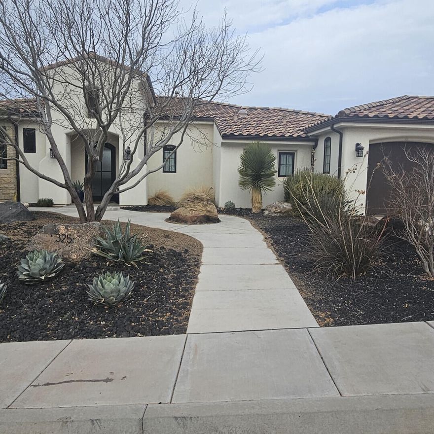 This stunning single-family home located at 325 E Zion Tr N in Toquerville, UT was built in 2019 and boasts a modern design with high-end parade home finishes throughout. The spacious property features 3 bedrooms, 2 full bathrooms, and 1 half bathroom, a separate office, pool with spacious deck, both front and back patios, 2 outdoor fireplaces and the best views in Toquerville shown off by large plate glass windows. With a finished area of 2,611 sq.ft. and a lot size of 12,197 sq.ft., there is plenty of room for relaxation and entertaining. Buyer to verify all info.