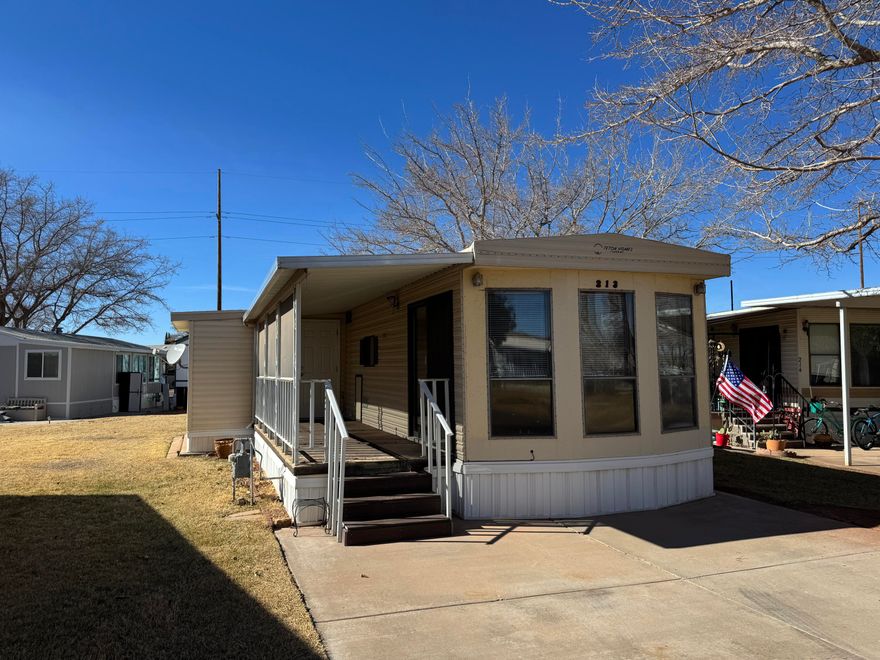 Charming 2-Bedroom Park Model in Sunny Southern Utah! This 2-bedroom, 1-bath home sits on an extra-large 0.09-acre lot with lots of windows and new blinds for natural light and privacy. Enjoy the covered back patio with a connected shed and a welcoming front porch. Located in a fun, active community with great amenities. Don't miss this perfect getaway or full-time home—schedule your showing today! Buyer to verify all information.