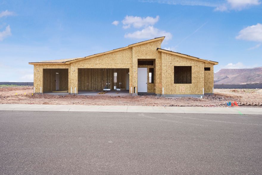 New home in beautiful Sky Mountain golf course development, offering refined living with the freedom to personalize! Finishing construction, this 3-bedroom, 2-bathroom 3 Car Garage home perfectly blends comfort and functionality. Enjoy beautiful sunsets. Home equipped with quartz countertops, soft-close doors and drawers, a stunning tile primary shower, durable LVP flooring, and stylish two-tone paint. Added privacy and security with rear and side wall already included. Don't miss the chance to own a brand-new home in a community where you have the freedom to make it yours! Photos are of a similar home. Contact one of our agents today to find out how you may customize this home to your style. Hurry in today! An amenities association is available; ask one of our agents about the details.