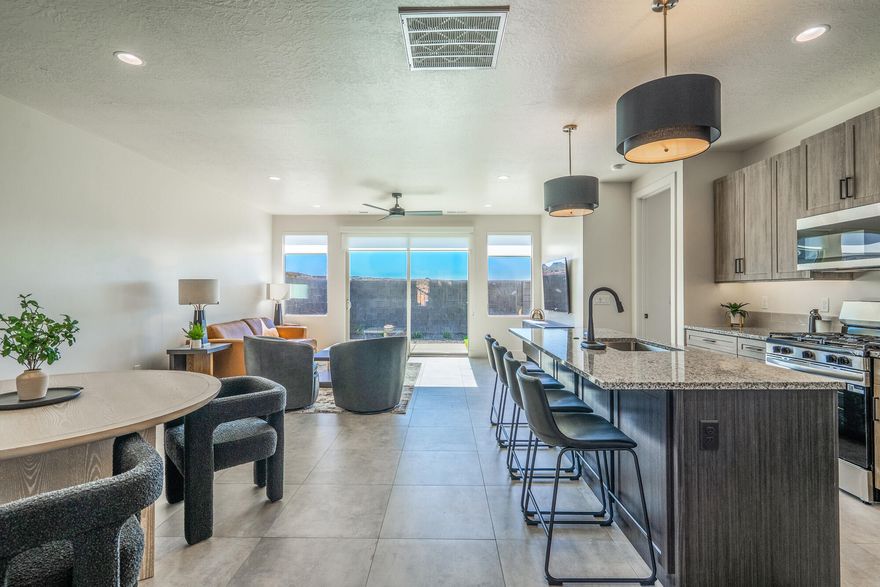 The Luna - This well-designed 3-bedroom, 2.5-bath home offers modern living with an open-concept layout connecting the spacious great room and stylish kitchen. Features include thermofoil cabinetry, granite countertops, a single-bowl stainless steel undermount sink, and a Frigidaire stainless steel appliance package with electric range, microwave hood, dishwasher, and refrigerator. Interior finishes include two-tone paint, tile or laminate flooring in main living areas, carpet in bedrooms, can lighting throughout, and ceiling fans in the living room and bedrooms. Bathrooms feature Moen plumbing fixtures and custom tiled showers/tub surrounds. Additional highlights include a laundry room with sink cabinet, extended finished garage with 50-amp EV breaker and room for a workshop or toys, block walls, and backyard space. Community amenities include a pool, hot tub, pool house, pickleball court, playground, and RV parking.

Pool House, Playground and BBQ area coming NOW!

Photos of similar home. Same floor plan; finishes, colors, and layout orientation may vary.