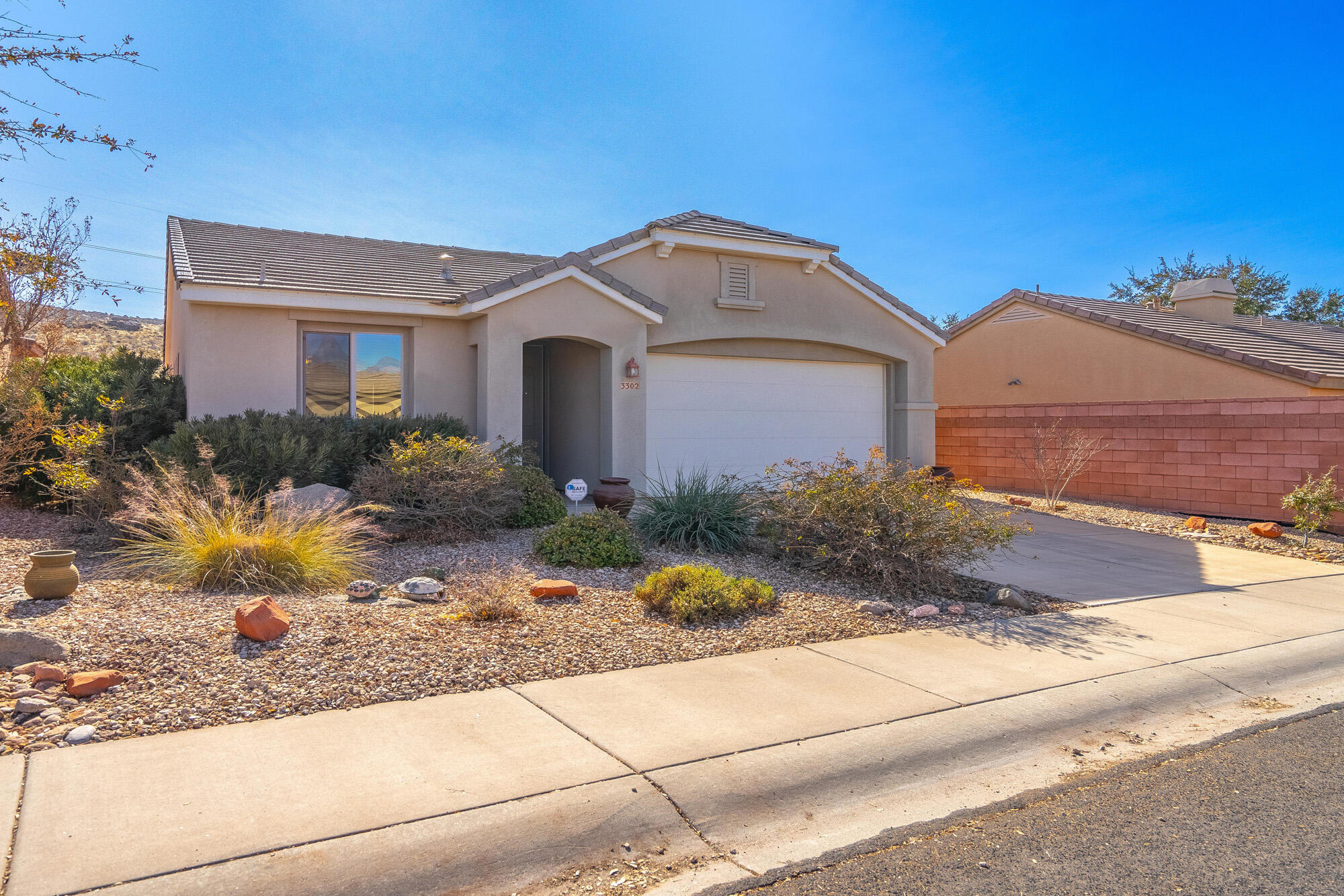 Well cared for lightly used as a second home. One of the largest lots in the Fourteen Fairway community.  Low maintenance exterior and landscape. Putting green.  Private yard with no neighbor to the back. Across the street is a wonderful community park. Trail head around the corner gives you access to over 10 miles of paved biking and walking trails.  Plus access to the amazing Coral Canyon amenities including indoor and outdoor pools, pickleball and tennis courts, splash pads, several parks and just down the street from Razor Ridge fishing pod.  Easy to show - Text agents for an appointment.