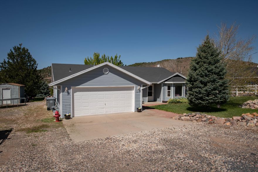 Welcome to  371 N Pinion Cir in Central, Utah. This charming single-level home offers 3 bedrooms, 2 bathrooms, and approximately 1,467 square feet of comfortable living space, thoughtfully designed for easy, functional living. Situated on a spacious 0.34-acre lot, this property provides the ideal balance of privacy and open space--perfect for enjoying the peaceful surroundings and stunning natural landscape that Central is known for. Step inside to find a bright and inviting layout with a seamless flow between the living, dining, and kitchen areas, making it ideal for both everyday living and entertaining. The single-level design offers convenience and accessibility, while the well-sized bedrooms provide comfort for family, guests, or a home office setup. Outside, you'll appreciate the room to spread out--whether that's creating your dream outdoor living space, parking toys, or simply enjoying quiet evenings under the Southern Utah sky. Located just a short drive from St. George, this home offers the tranquility of rural living with easy access to city amenities. If you've been looking for a clean, functional home with space, privacy, and that true ''get away from the city'' feel--this one checks the boxes.
