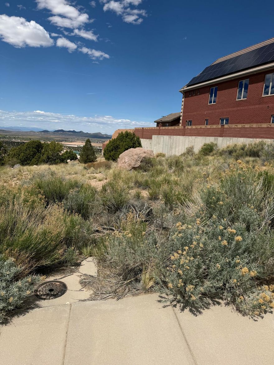 Prime opportunity to build your custom home in the desirable Carmel Ridge / Carmel Canyon area of Cedar City. This spacious 0.46-acre lot offers a great setting with curb, gutter, and sidewalk improvements already in place, surrounded by quality homes in an established neighborhood. Enjoy the balance of quiet residential living while remaining just minutes from Southern Utah University, schools, shopping, dining, and downtown Cedar City. Outdoor enthusiasts will appreciate quick access to year-round recreation, including Brian Head Resort, Cedar Breaks, Zion National Park, and Bryce Canyon. A great option for a primary residence, second home, or investment build in one of Southern Utah's growing markets.
