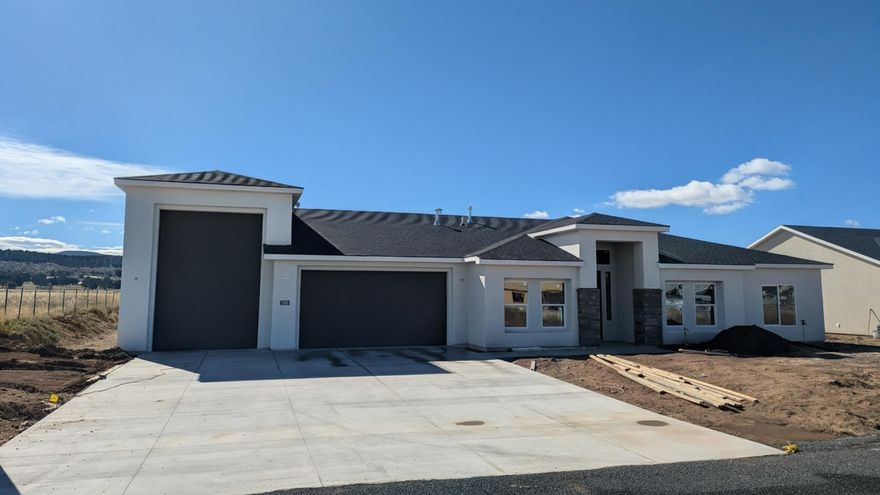 Enjoy the safety and comfort of small town living in Enterprise! This new construction home is built by an experienced local builder on a nice sized lot. It offers beautiful fixtures, tile flooring, quartz countertops, large bedrooms and a spacious RV garage! This gem is priced to sell! Located in a new area close to the beautiful community park, complete with a pond and walking path, with a great view and a peaceful mountain feel. Just a quick commute from St. George or Cedar City waits your next adventure! 
40 ft RV Garage. Door: 10' X 14'
All information deemed reliable, but not guaranteed. Buyer to verify all information.