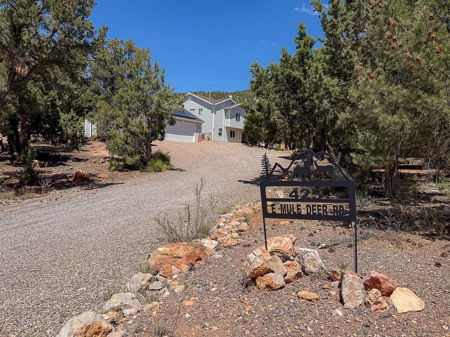 Welcome to your dream retreat in Central! This 3 bed, 3 bath home sits on 1.4 acres with incredible mountain views, perfect for peaceful living. The spacious layout features two inviting family rooms, ideal for entertaining or relaxing. Enjoy outdoor living on the large deck, perfect for gatherings. A detached 3-car garage, solar power, and fenced-in dog run offer comfort and convenience. With plenty of space for animals and room to build a shop, this property is ready for your lifestyle. Surrounded by ATV/UTV trails and the charm of Central, this is country living at its finest!
