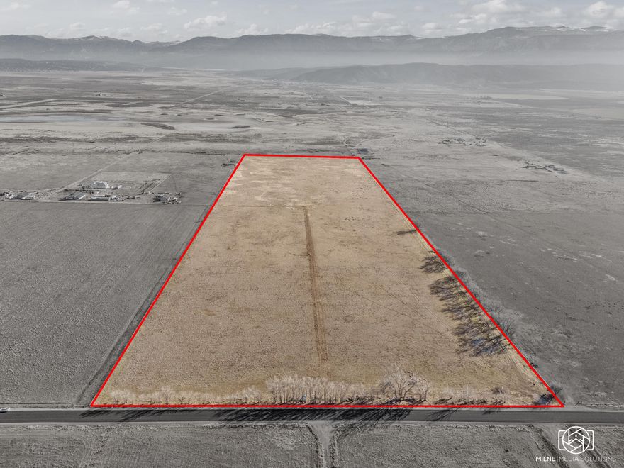 Build Ready 50-acre parcel with water and power for 2 or more homes.

Key features
- 50 acres of flat, build-ready land with limitless potential for a private estate, a boutique community, or a high-value subdivision of multiple homes
- Dramatic panoramic views that stretch to the horizon
- Seller-has 3 home plans available for purchase to jumpstart your development
- Water security with a powerful 5 hp culinary well and 1929 water rights granting access to 6 acre-feet of water
- Electricity available on-site, simplifying the development process
- Ample space for recreational facilities, expansive gardens, guest accommodations, and more

Development potential
- A rare opportunity in a booming area poised for future growth
- Flexible use: private estate, charming cluster of homes, or an attractive investment
- Ready-to-execute framework with existing water rights and utilities to accelerate your plans

This isn't just land--it's a gateway to a lifestyle and a smart investment in a flourishing community. Whether you're envisioning a private retreat, a thoughtfully designed neighborhood, or a strategic hold for the future, this prime parcel is ready to bring your vision to life.