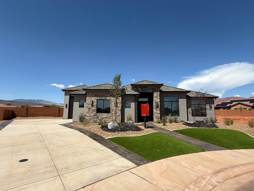 Completed new construction! LARGE lot on a quiet cul-de-sac in the heart of Ivins. This beautiful home has stunning design selections and so many upgrades:
The kitchen cabinets are a rich Iron Ore color around the perimeter with a beautiful, light knotty alder island.  The home has lovely quartz counters throughout, and a beautiful iron front door. The 39.1 RV garage with a 10X14 door has so many possibilities, AND there is room for RV parking on the side (and then some). Close to trails, Tuacahn Amphitheatre, Snow Canyon, and Gunlock Reservoir.