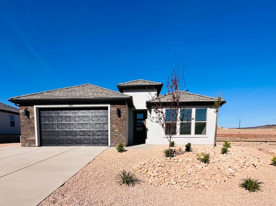 Discover exceptional craftsmanship and timeless design in this beautifully appointed 3-bedroom, 2-bath residence located in the highly desirable Divario community. Thoughtfully constructed with 2x6 exterior wall framing, this quality-built home offers both enduring value and elevated comfort.
Inside, you'll find upscale finishes throughout, including 42'' upper cabinetry, elegant quartz countertops, 8' interior doors, and a spa-inspired primary bath featuring a stunning tiled shower. The oversized, fully finished 2-car garage provides generous space for vehicles, storage, and lifestyle needs.
Situated in a premier location surrounded by scenic red rock beauty, residents enjoy access to a private community pool and bathhouse, along with nearby trails and parks that enhance the Southern Ut