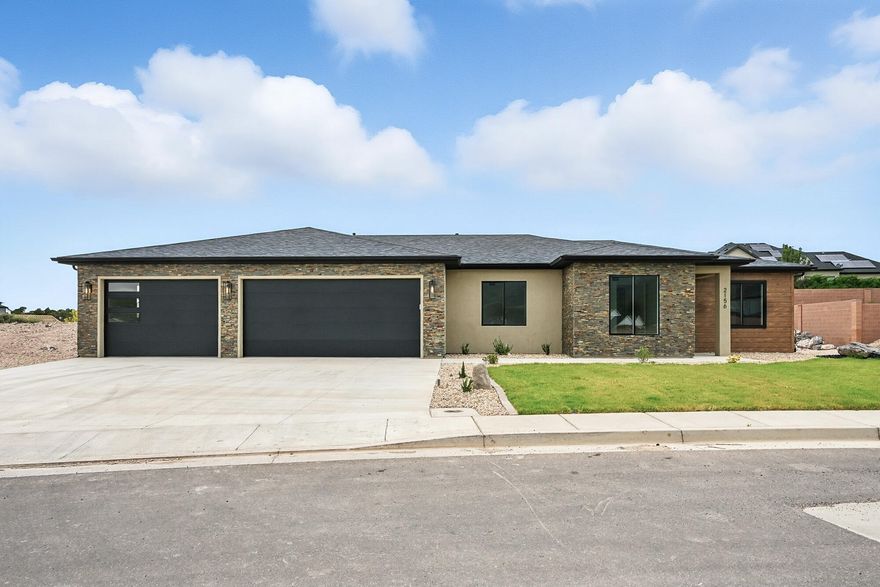 Discover this New Construction 4-bed, 2-bath home in The Bluff at South Mountain, with no HOA! This 2,055 sqft home boasts walnut cabinets, granite countertops, and tile backsplash in the gourmet kitchen, complete with a butler's pantry. The open living room impresses with a tray ceiling, electric fireplace and built-in walnut cabinets and shelving. The primary suite features a large tiled and euro glass walk-in shower, soaking tub, and dual sinks. The 3-car garage is the star of the show! The 3rd bay is 47' which would allow for a 4th car or a workshop. The garage features LED lighting, an EV plug, plumbing for a sink and hot and cold water. The front landscaping is complete and the back is retained highlighting the natural rock outcroppings and breathtaking views! Home is move in ready!