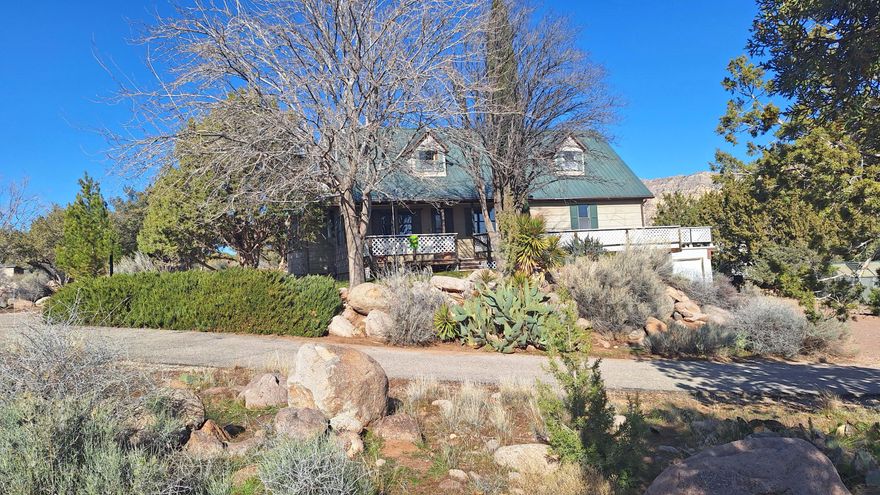 This incredible property has endless possibilities! Including a home, 12.35 acres of land (10 acres fenced), a 900 sq ft shop with water and power, a 196 sq ft 'she shed' with bathroom + loft, and all this in a great location. The home includes 3 bedrooms, 4 bathrooms, an attached 2 car garage, a basement living area with kitchen, bathroom, 2 non-conforming bedrooms, and entrance through the garage. Feel secure in your own homestead with the included 2.5 acre-feet of
water rights and a private well. Now, let's talk about the great location! Less than 5 minutes from the Toquerville exit, there's easy commuting to either St. George or Cedar City. and within 4 miles is a new subdivision, a new travel stop, the new Toquerville reservoir, and lots more. Give this property a closer look today!
