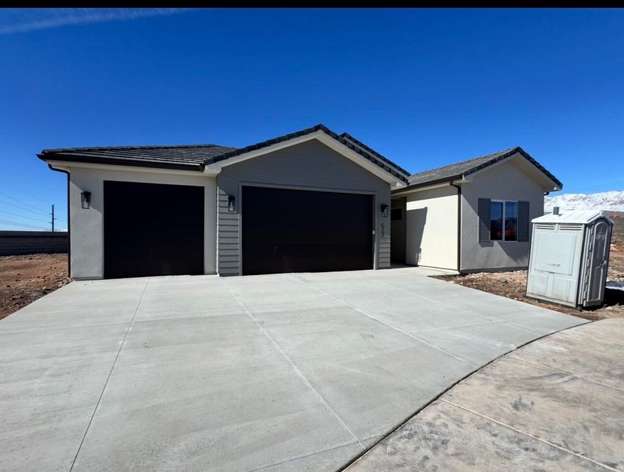 This well-designed home sits on a large lot in an exceptional community and offers impressive views from expansive windows. Highlights include a 26' third-car garage, 12' vaulted ceilings, and an oversized kitchen island perfect for gathering and entertaining. Finishes include 8' interior doors, quartz countertops, luxury vinyl plank flooring, and a spacious primary bathroom with a fully tiled walk-in shower. Ample space for RV parking and outdoor living makes this home a great fit for a variety of lifestyles. Don't miss this opportunity.