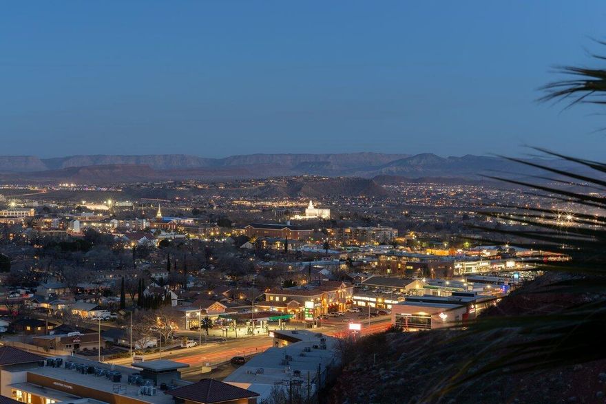 Located in the highly desirable Ridge at St. George, this well-maintained 3 bed, 2 bath home offers million-dollar panoramic views overlooking the city, surrounding red rock cliffs, and wide-open Southern Utah skies. Elevated above it all, the setting delivers privacy, scenery, and unforgettable sunsets day after day.
Inside, the home features a bright, open layout filled with natural light. Large picture windows in the main living areas frame the views and bring the outdoors in, while the living room centers around a cozy fireplace, creating a comfortable space for relaxing or entertaining. The kitchen and dining areas flow seamlessly, offering functionality and ease for everyday living.
The primary suite is a peaceful retreat with generous space, direct access to the en suite bath, and a walk-in closet. The en suite includes dual vanities, ample cabinetry, and a walk-in shower. Two additional bedrooms provide flexibility for guests, a home office, or hobbies, and the second bathroom is thoughtfully positioned for convenience.
Outdoor living shines with a covered patio perfectly positioned to enjoy the sweeping views. Whether sipping morning beverage or winding down at sunset, this space offers a front-row seat to the beauty of St. George. Low-maintenance landscaping allows you to enjoy the setting without the upkeep.
Additional highlights include a spacious two-car garage with excellent storage, a dedicated storage room, and well-organized utility spaces that add to the home's practicality and appeal.
Situated in a quiet, established community close to golf, trails, shopping, dining, and everyday conveniences, this home combines comfort, functionality, and a view that never gets old. A rare opportunity to own an elevated view property in one of St. George's most sought-after neighborhoods.