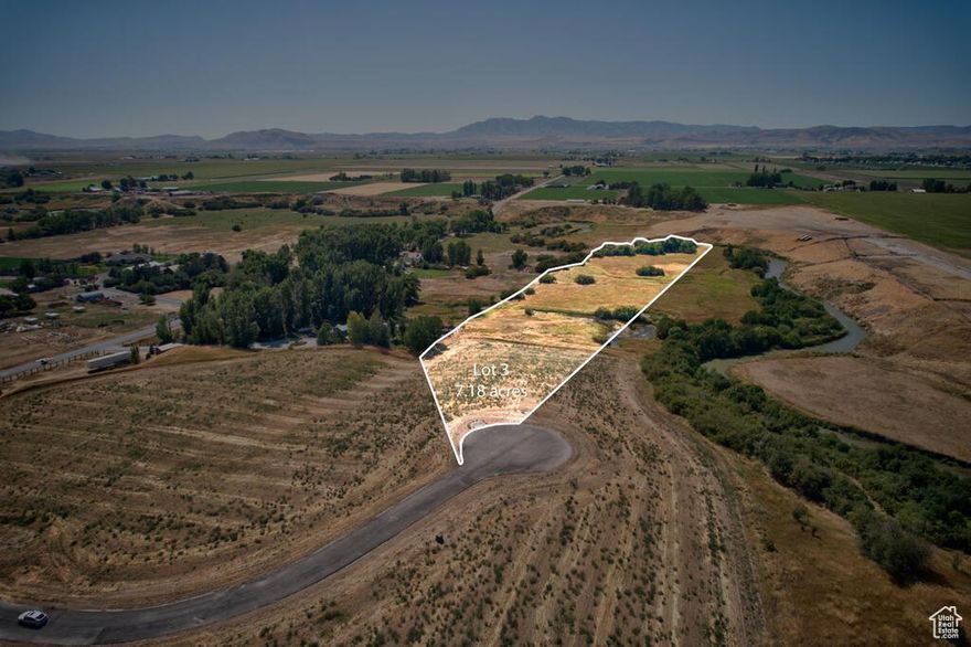 Exceptional 7.1-acre parcel with a spring fed pond, pasture and 400 ft of Cub River frontage. A rare find with this much usable land. Perfect for water, open space and recreation right out your back door. Only 15 minutes from Cherry Peak Ski Resort.