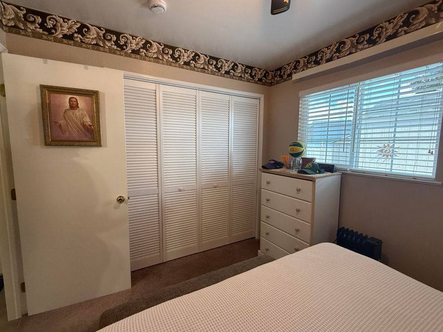 Nestled near restaurants, shopping, and outdoor recreation, this 1-bedroom, 1-bath home offers low-maintenance living on an owned lot in a 55+ community. The low HOA includes a clubhouse, pool, water, garbage, yard maintenance, and road upkeep. This stick-built home boasts new fittings & pex piping, excellent insulation, AC units, 2 parking spaces, gas stubbed to property line and a metal roof with a lifetime warranty. New Carport Awning, New Mini Split and New Shed! Whole house repainted in the last year with an epoxied deck and new sturdy handrail.