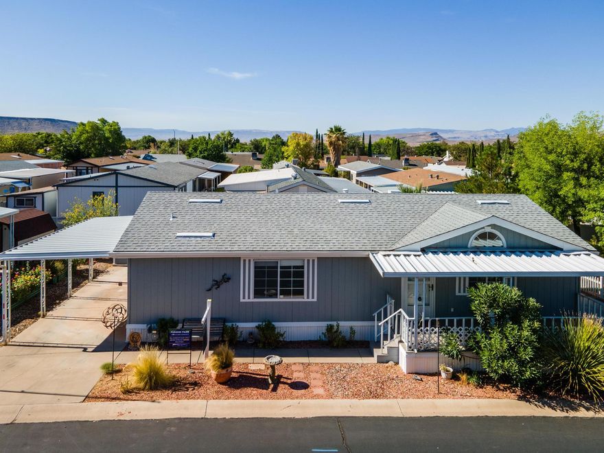 Located in the desirable 55+ Paradise Palms community, this well-maintained home offers a bright, open layout with a spacious front room perfect for a home office, hobby space, or second living area. Enjoy oversized bedrooms, a fully fenced yard, and two large storage sheds, with all appliances included for added convenience. Paradise Palms operates as a cooperative, with the shared land loan scheduled to be paid off in early 2027, and the HOA covering water and cable for worry-free living. Conveniently close to shopping, schools, and golf courses. Buyer must be approved by the community, and all information is deemed reliable but should be verified by the buyer.