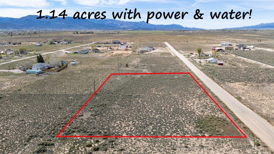 1.14 acre lot with power, water right and a shared culinary well. Mountain views, a good gravel road, animal rights, and only minutes to town - this lot has so much potential! A well is already in place on the adjacent lot and purchase of this lot includes 50% ownership in that well, allowing you to begin building quickly; .46 acre foot of water right included to build a home, and the power line and partial fence runs across the back of the property. Will need septic and propane. There is plenty of room for home, casita, shop, RV parking, and greenhouse. Don't wait, this rare find will not last long.