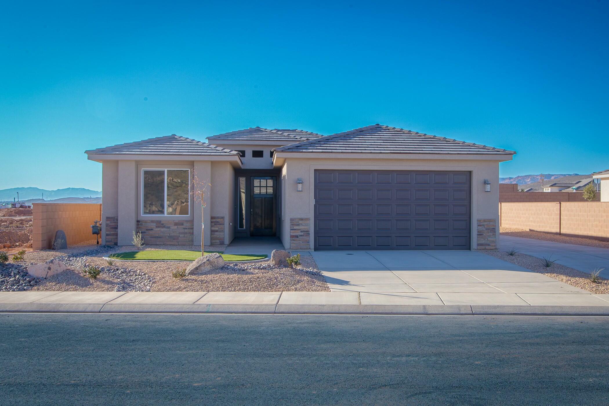 Under Construction! Estimated finish date - May, 2025. This home features drought-tolerant professionally landscaped front and backyard with a covered patio. Master suite includes spacious walk-in closet and fully tiled walk-in shower. Two car garage is fully drywalled and painted! Quality GE appliances, stainless sink in the kitchen island, Moen Plumbing fixtures, quartz countertops, spacious pantry, and natural Alder cabinetry with soft-close hinges and under-cabinet lights. Loads of cabinet space! Woodgrain tile floors and gas fireplace in living room. Thirty-foot paved RV pad with water, 30-amp + sewer dump! Located on a corner lot. Come in and see us soon to customize the home to your liking. See you soon!