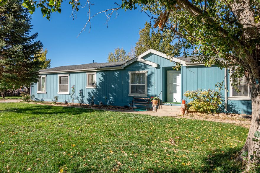 Charming Mini Ranch on 1 Acre - Peaceful End-of-the-Street Setting. Welcome home to this inviting 4-bedroom mini ranch tucked away in a quiet end-of-the-street location. Sitting on a full acre, this property offers the perfect blend of comfort, charm, and country living. Step inside to a warm and welcoming remodeled home with a functional layout and plenty of natural light. Outside, the acreage is fully fenced and ready for your animals, hobbies, or future plans. An oversized 2-car garage provides extra storage or workspace, and there's ample RV parking for all your outdoor adventures.  Enjoy room to breathe, space to grow, and the peaceful surroundings of this delightful property. A rare find with so much potential come experience the charm for yourself!